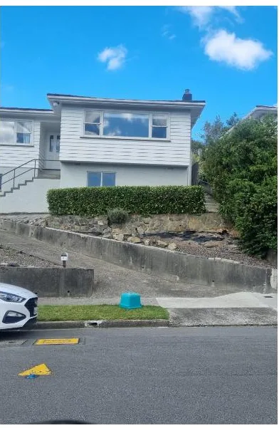 Front hedge trimmed level and garden cleared in front of the same house, Wellington