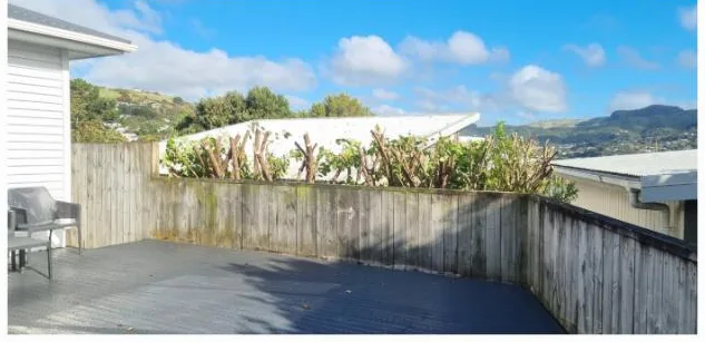Overgrown shrubs cut right back to open up a deck and the view, Wellington